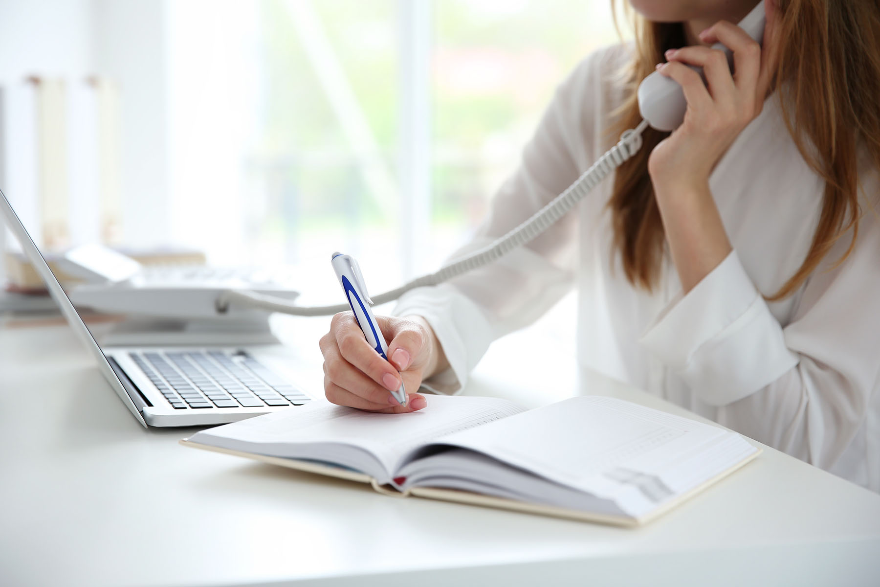 Woman on office phone